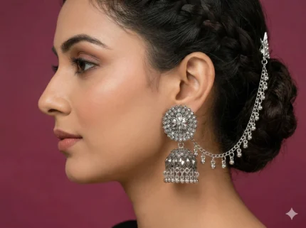 model wearing oxidized jhumka earrings with ear chain