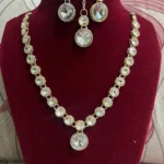 gold plated crystal round stone necklace set with earrings and maang tikka