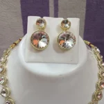 gold crystal necklace set with round stones and pendant earrings