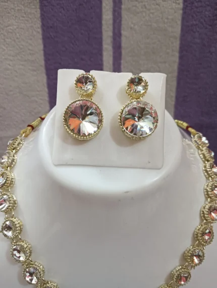 gold crystal necklace set with round stones and pendant earrings