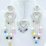 silver heart design necklace set with multicolor beads earrings and maang tikka