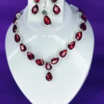red crystal drop necklace set with earrings and maang tikka silver plated