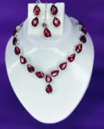 red crystal drop necklace set with earrings and maang tikka silver plated