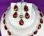red crystal drop necklace set with earrings and maang tikka silver plated