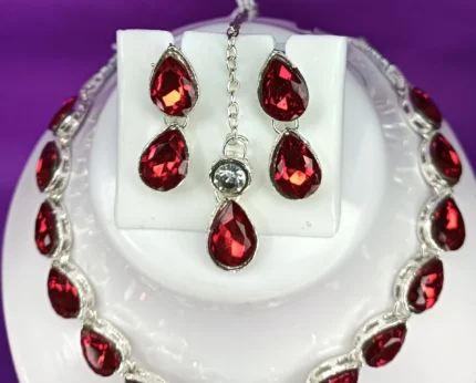red crystal drop necklace set with earrings and maang tikka silver plated
