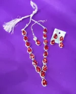 red crystal drop necklace set with earrings and maang tikka silver plated