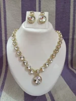 gold crystal necklace set with round stones and pendant earrings